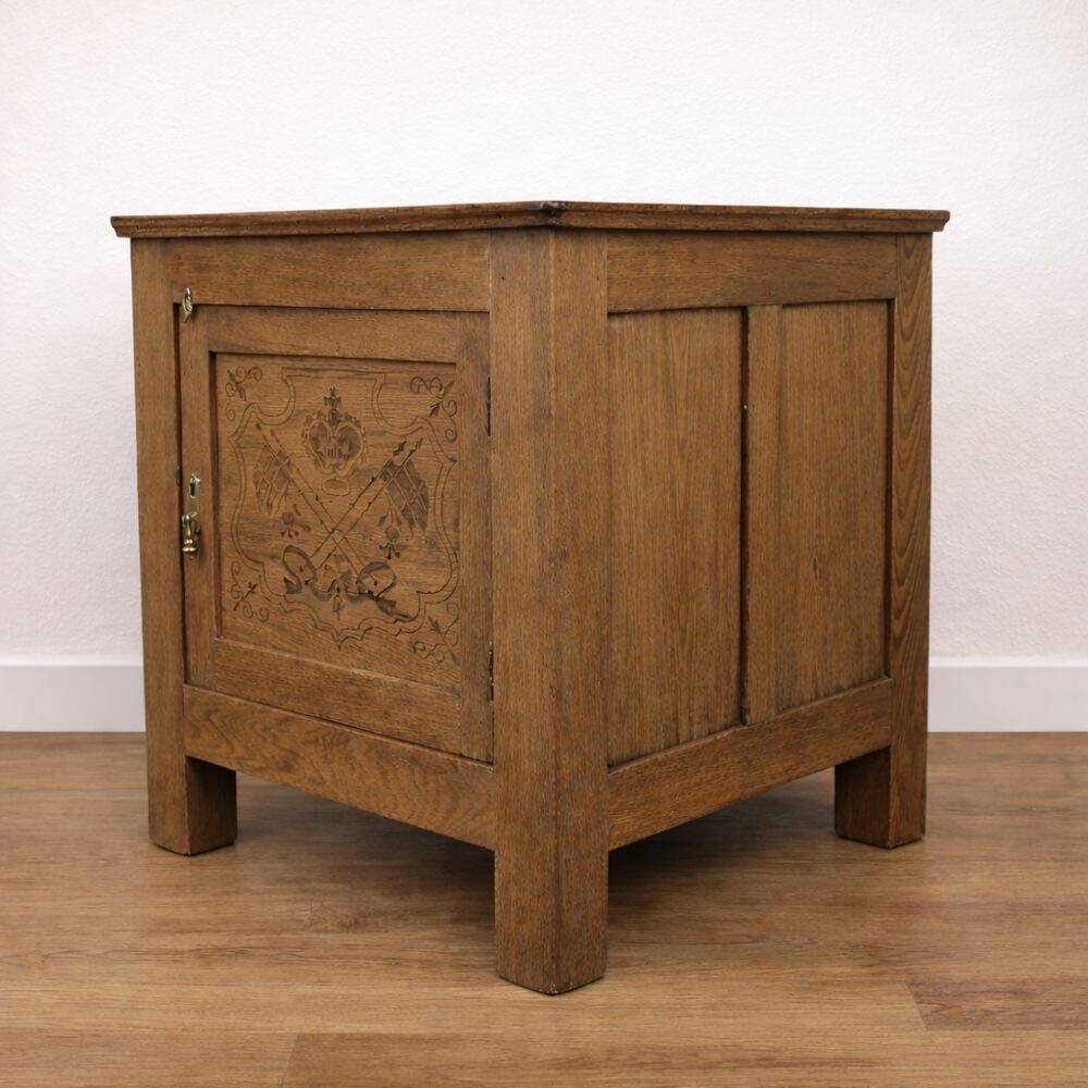 Oak side cabinet with carved motifs