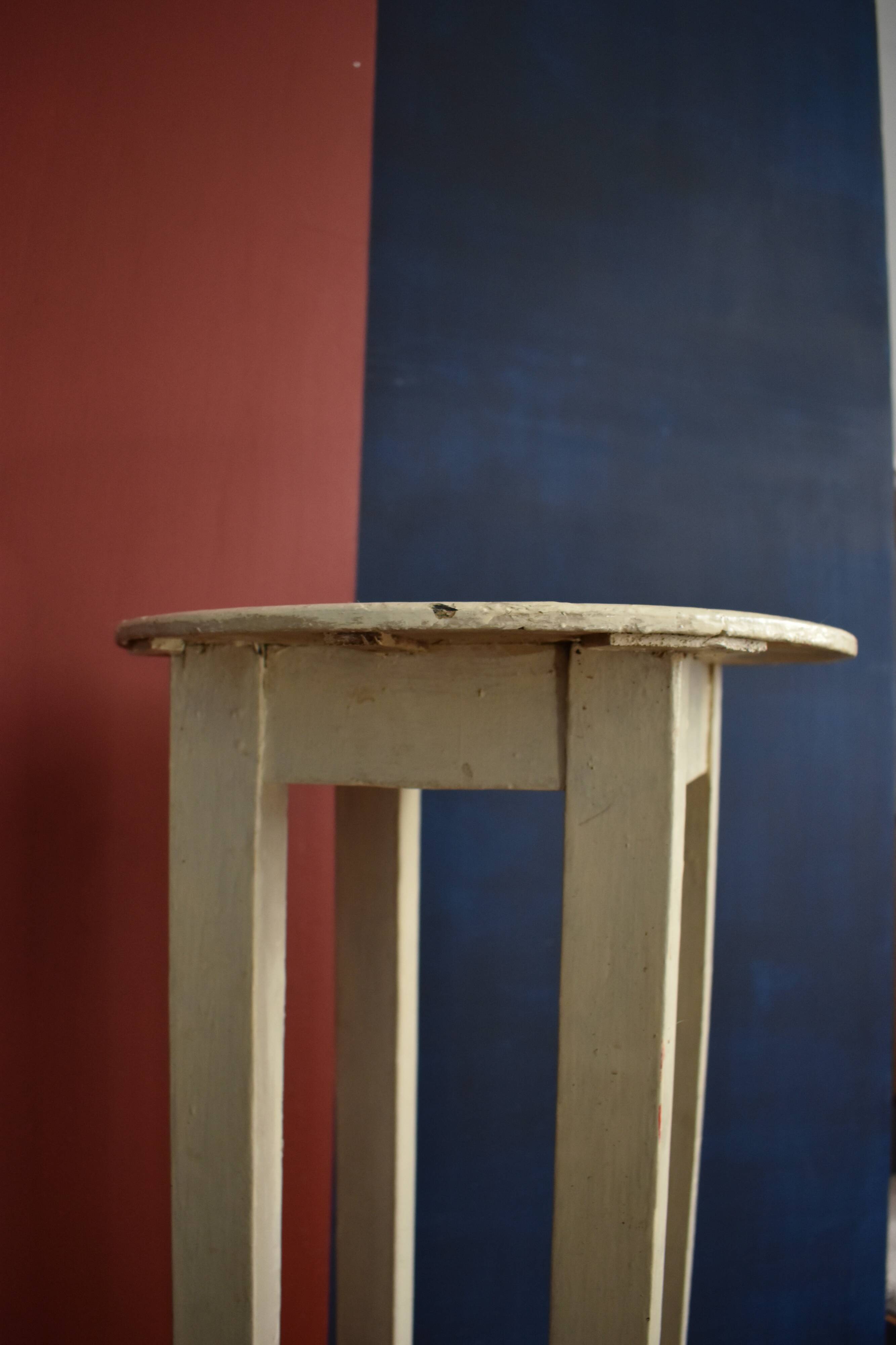 Old off-white wooden side table