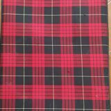 Vintage suitcase covered with scottish fabrics