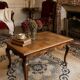 Antique coffee table with carved wood mouldings.