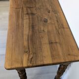 Antique writing table in the Napoleon III style with turned wooden legs.