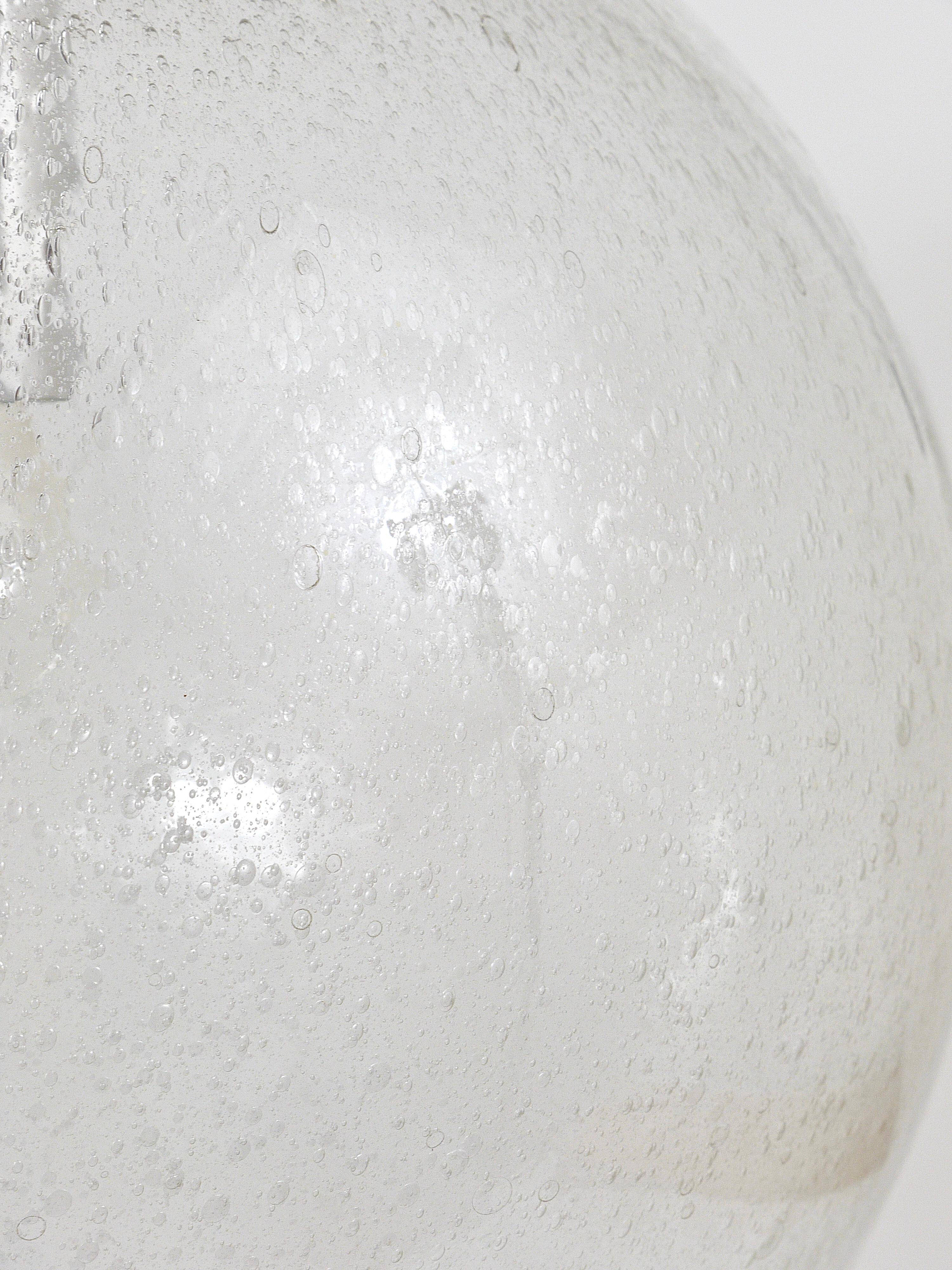 Large glass globe pendant light with bubbles and chrome by Peil & Putzler, Germany, 1970s.