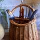 Covered rattan basket for lunch on 50s grass