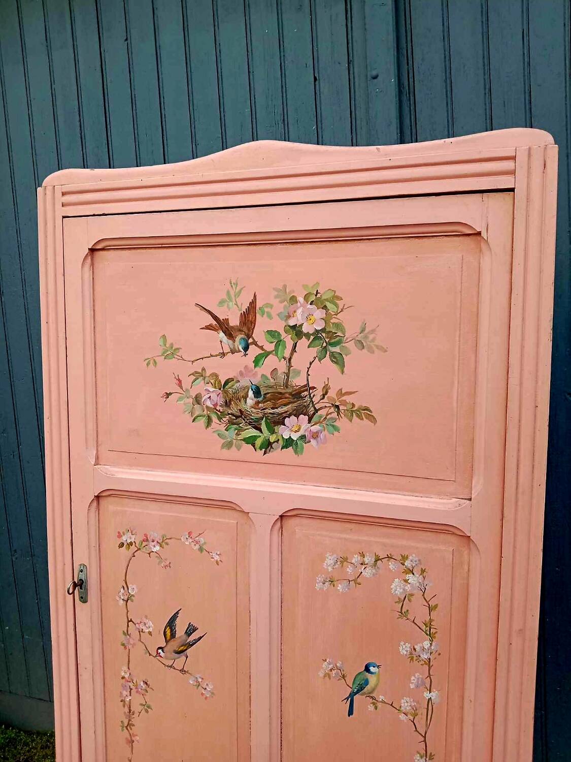 Old pink Parisian cabinet with painted decor