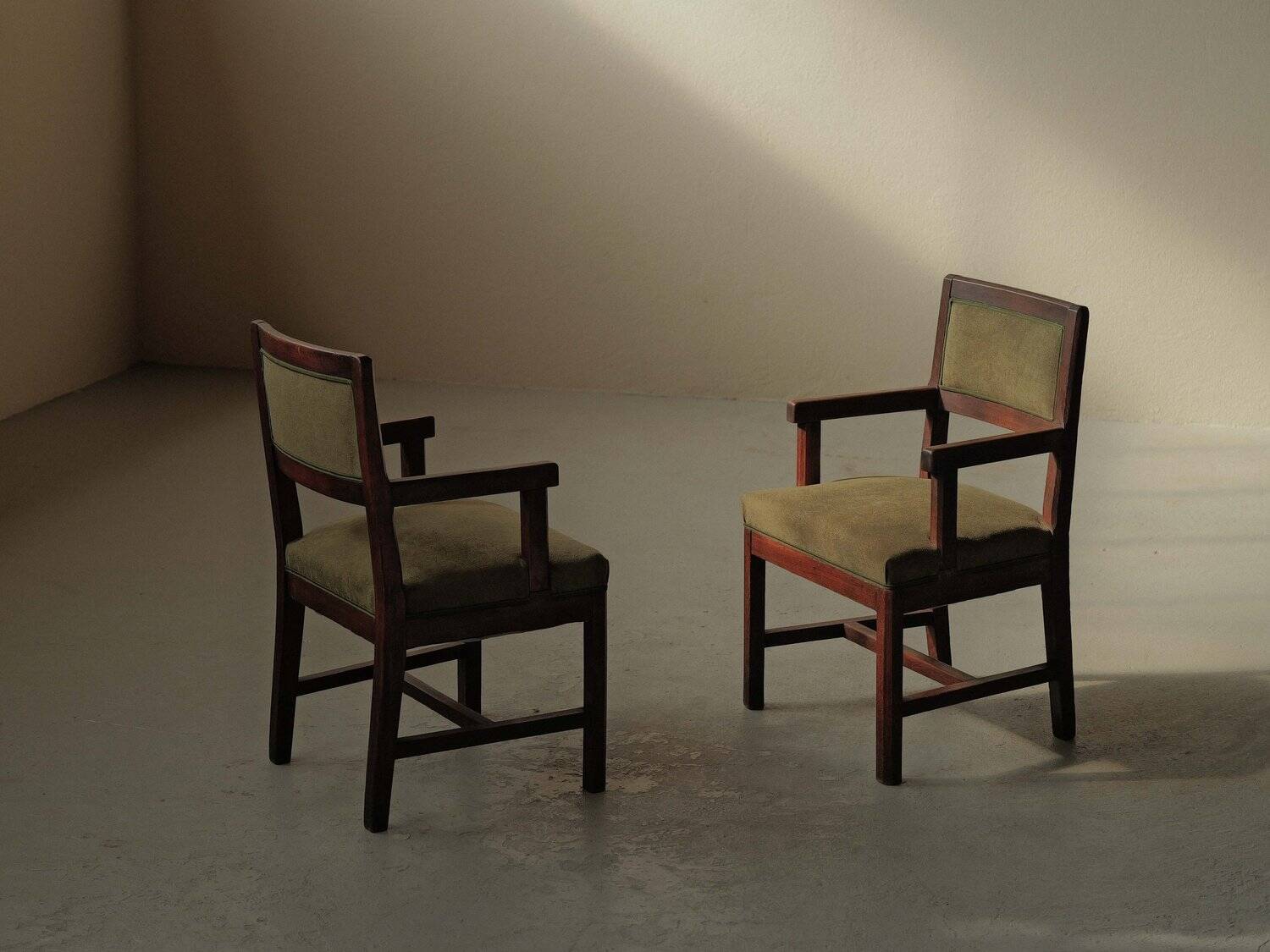 Pair of modernist armchairs in solid oak, France, circa 1940.