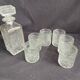 Chiseled glass whiskey service carafe and 6 Italian glasses