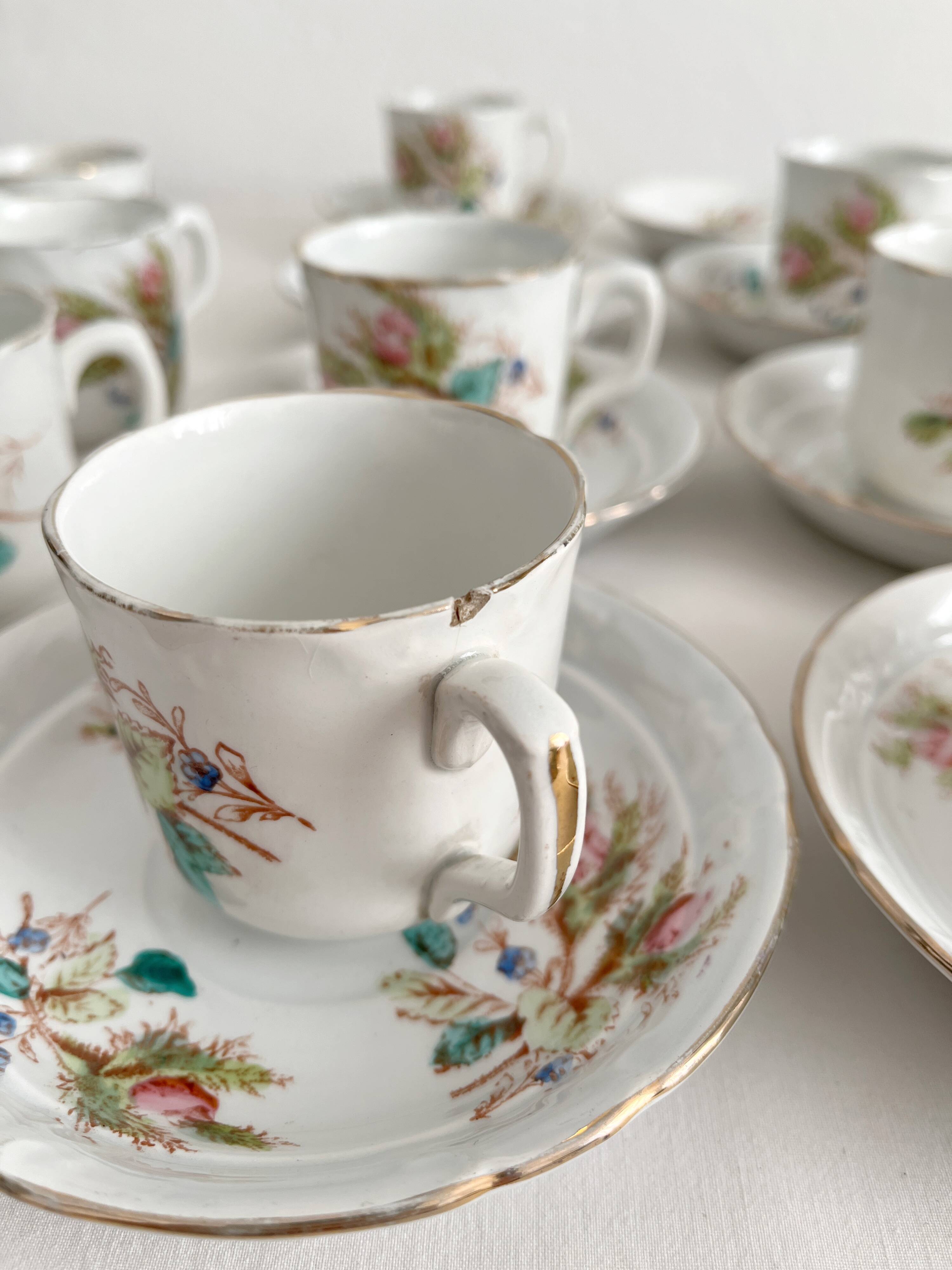 12 ironstone coffee cups with polychrome floral decoration, KG Lunéville