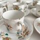 12 ironstone coffee cups with polychrome floral decoration, KG Lunéville