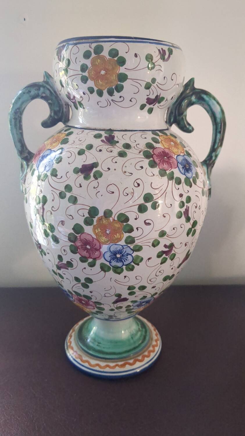 Old porcelain earthenware vase with floral decor