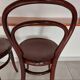 pair of round bistro chairs with a pattern on the seat, vintage
