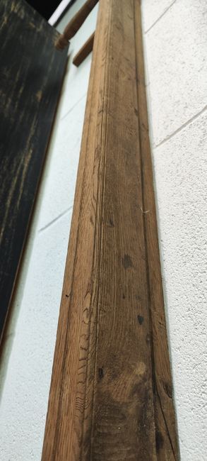 Old oak shelf back of glass counter wall