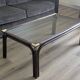Bamboo coffee table with brass corners and smoked glass