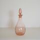 Bouteille en verre rose
