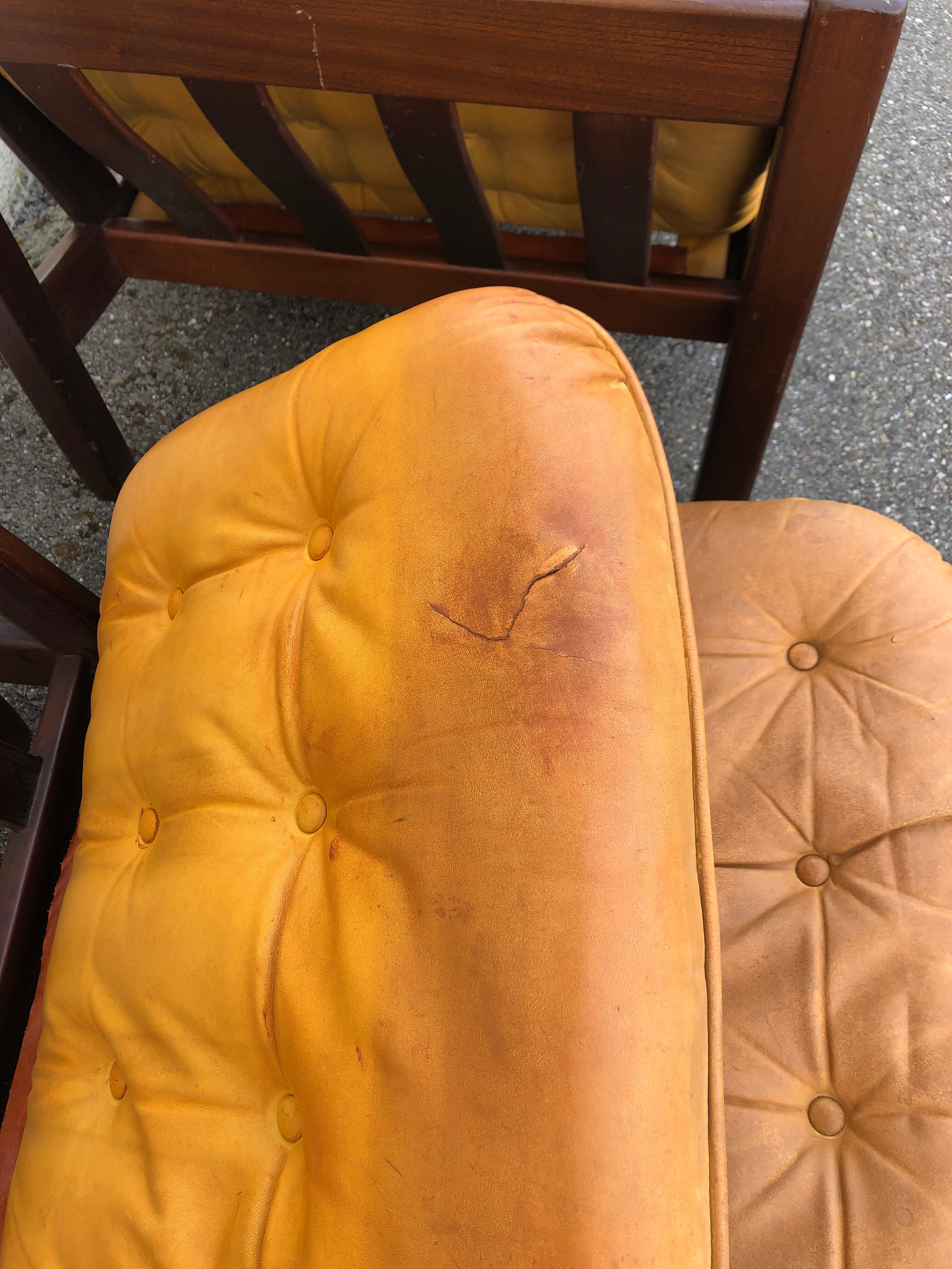 Leather and wood armchairs 70s