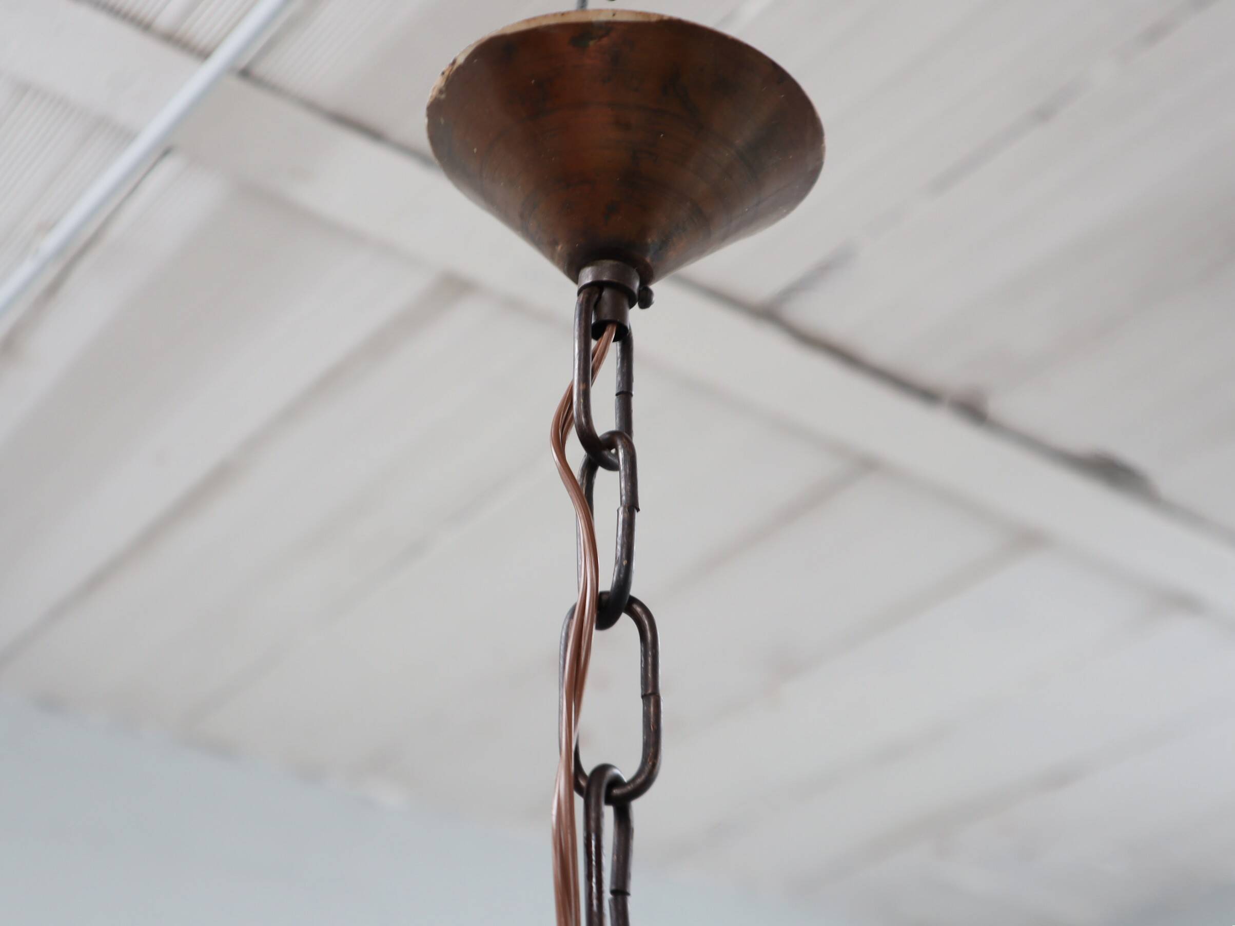 Pair of 1970s Brutalist Copper and Blown Glass Green Bottle Pendant Lamps