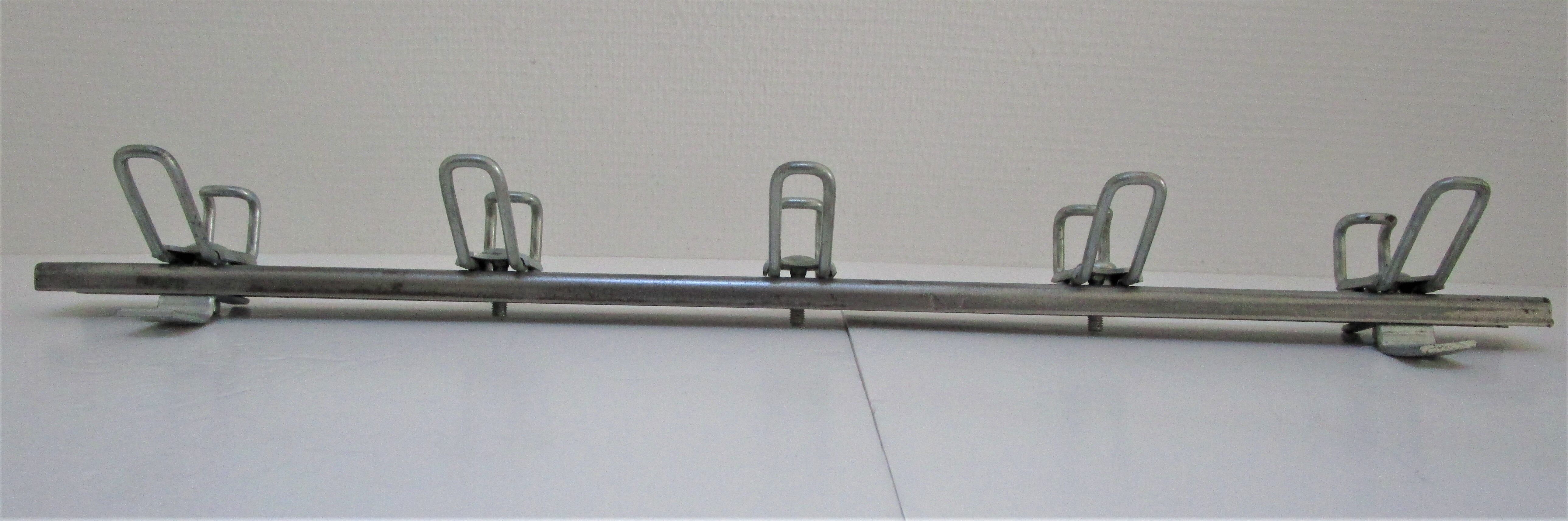 Vintage school wall rack in patinated steel