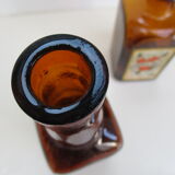 2 amber glass bottles with their old labels