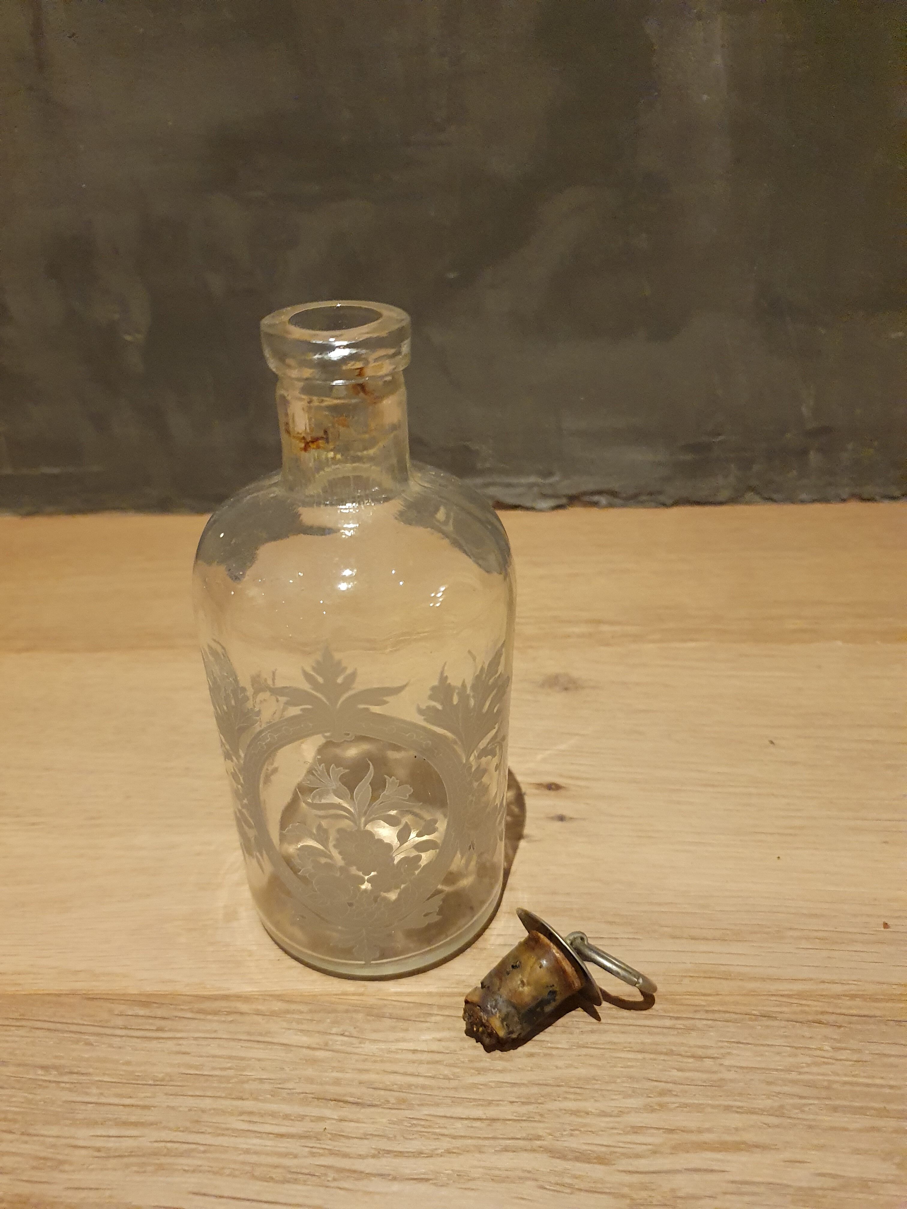 Bottle engraved with acid