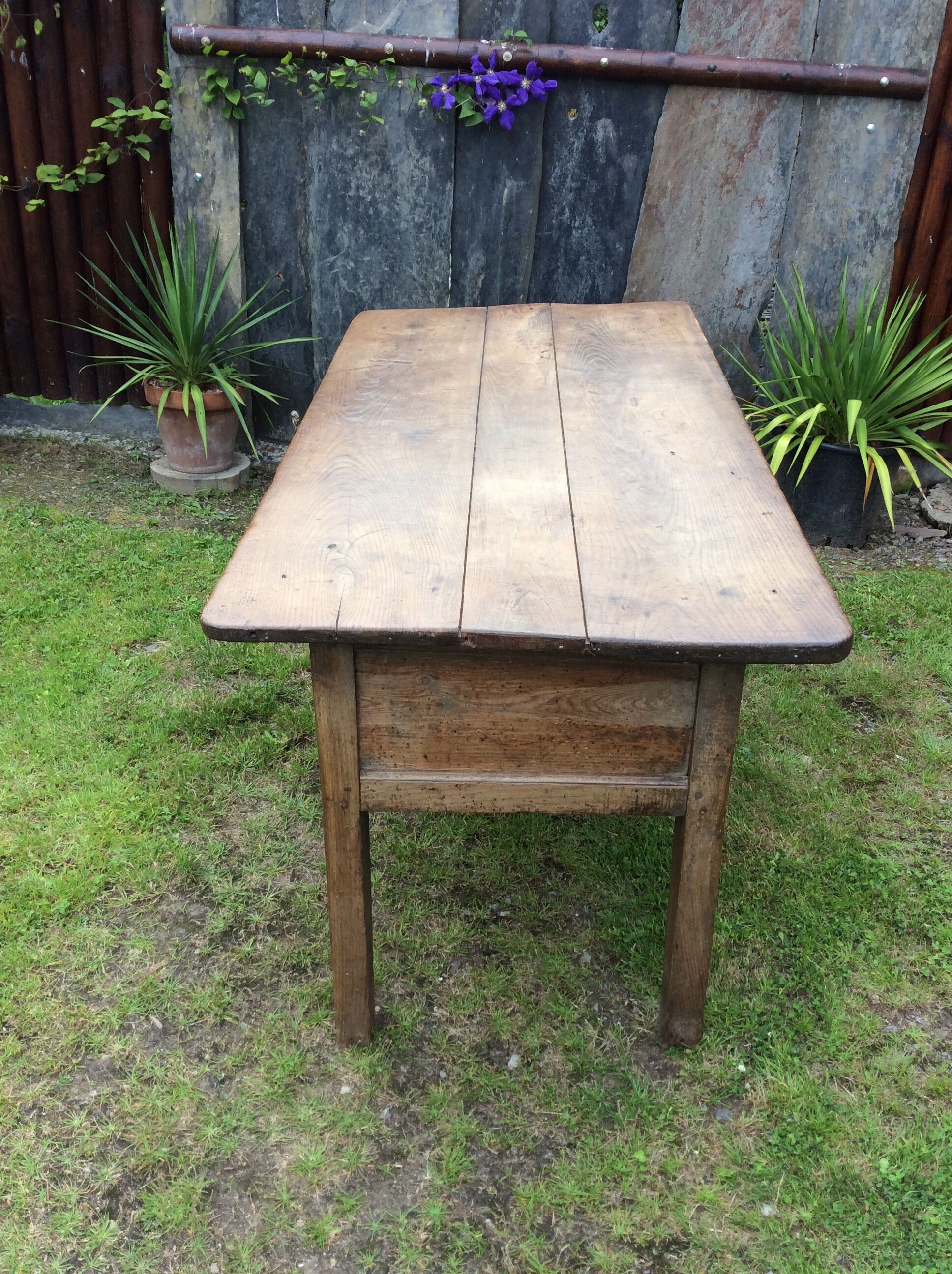 Farm table with panels with oak spindle feet. (said dairy table)