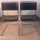 Paire de chaises en cuir noir et chrome modele Spoletto du designer Bersanelli