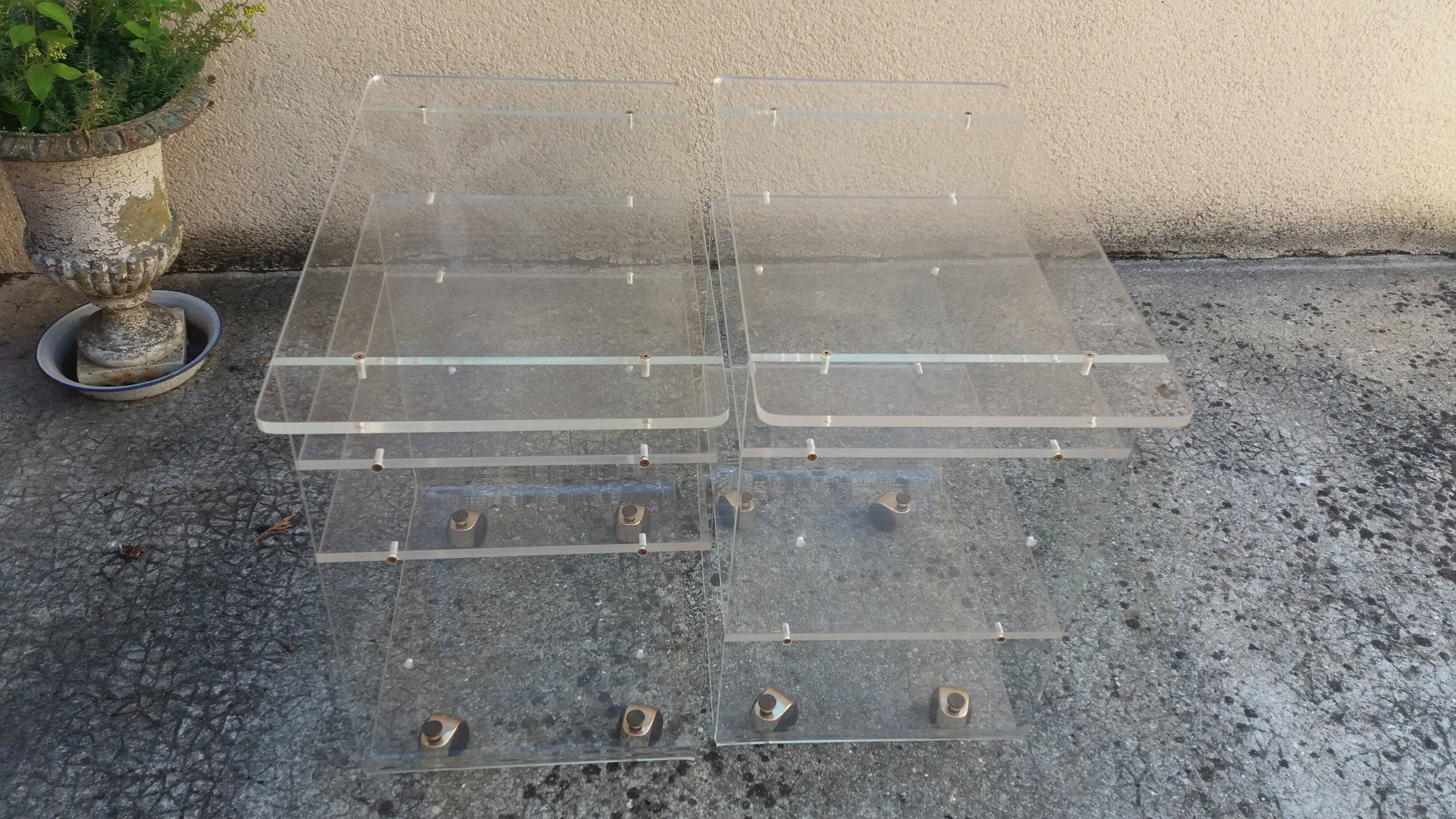Pair of Plexiglas services branded "Les Invisibles du Marais"