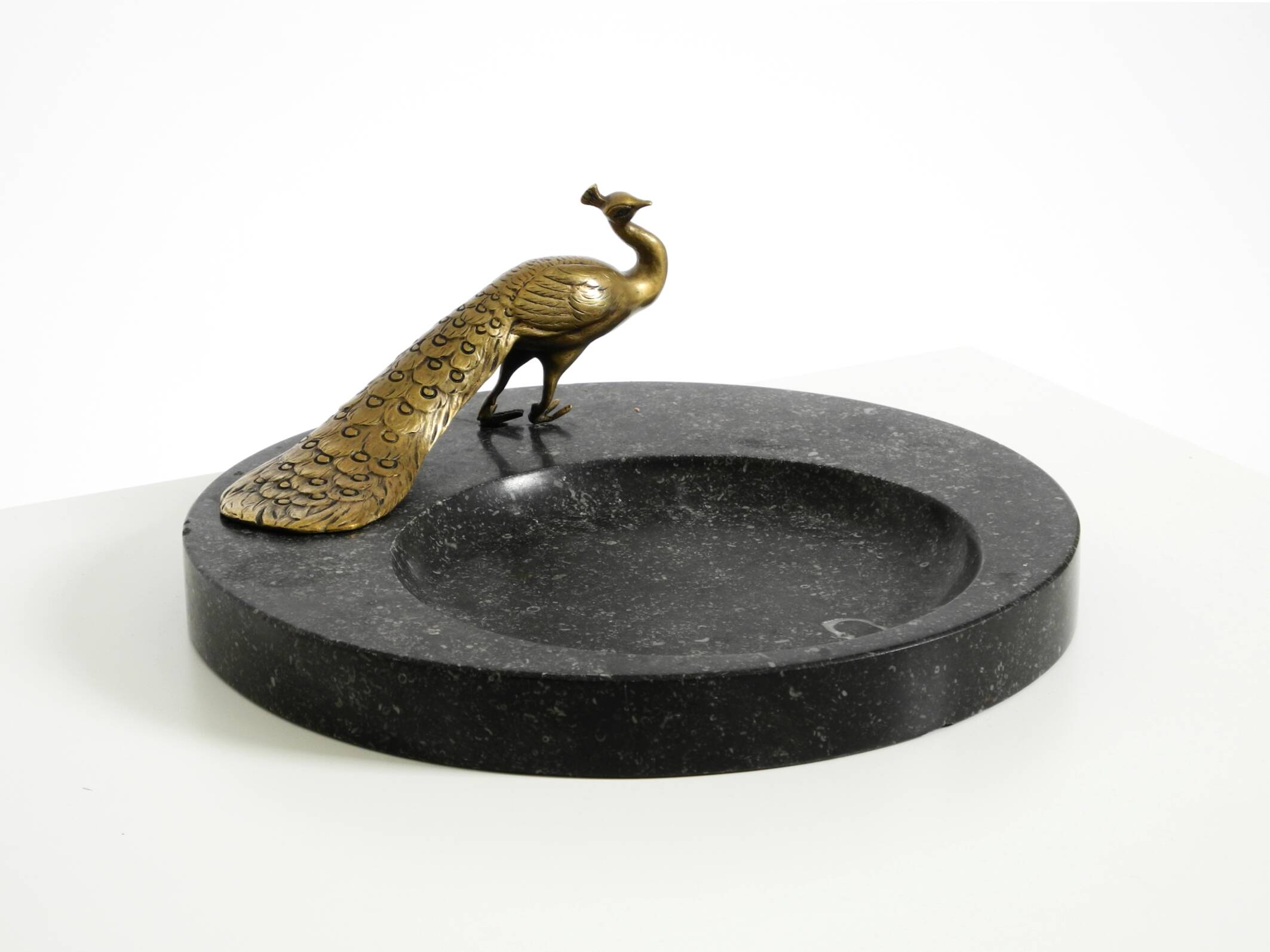 Beautiful, large black granite valet tray featuring a brass peacock, circa