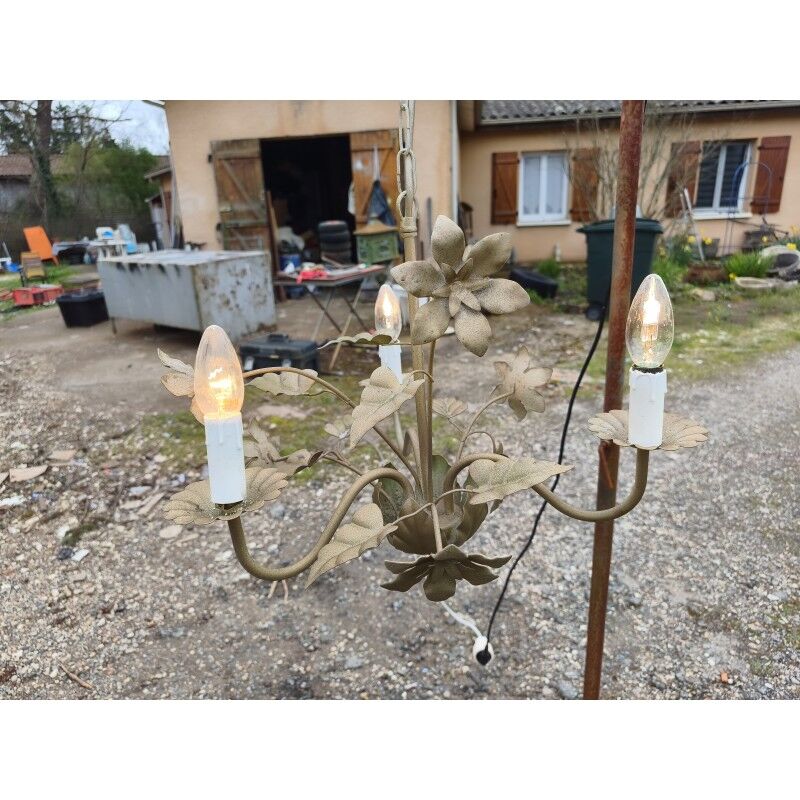 Vintage gold metal chandelier with floral decoration.
