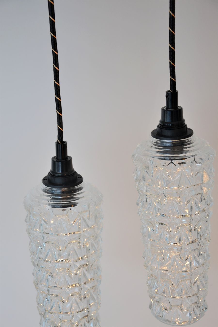 Pair of high-rise suspensions in chiseled glass - spindle shape of the 50s 60's -