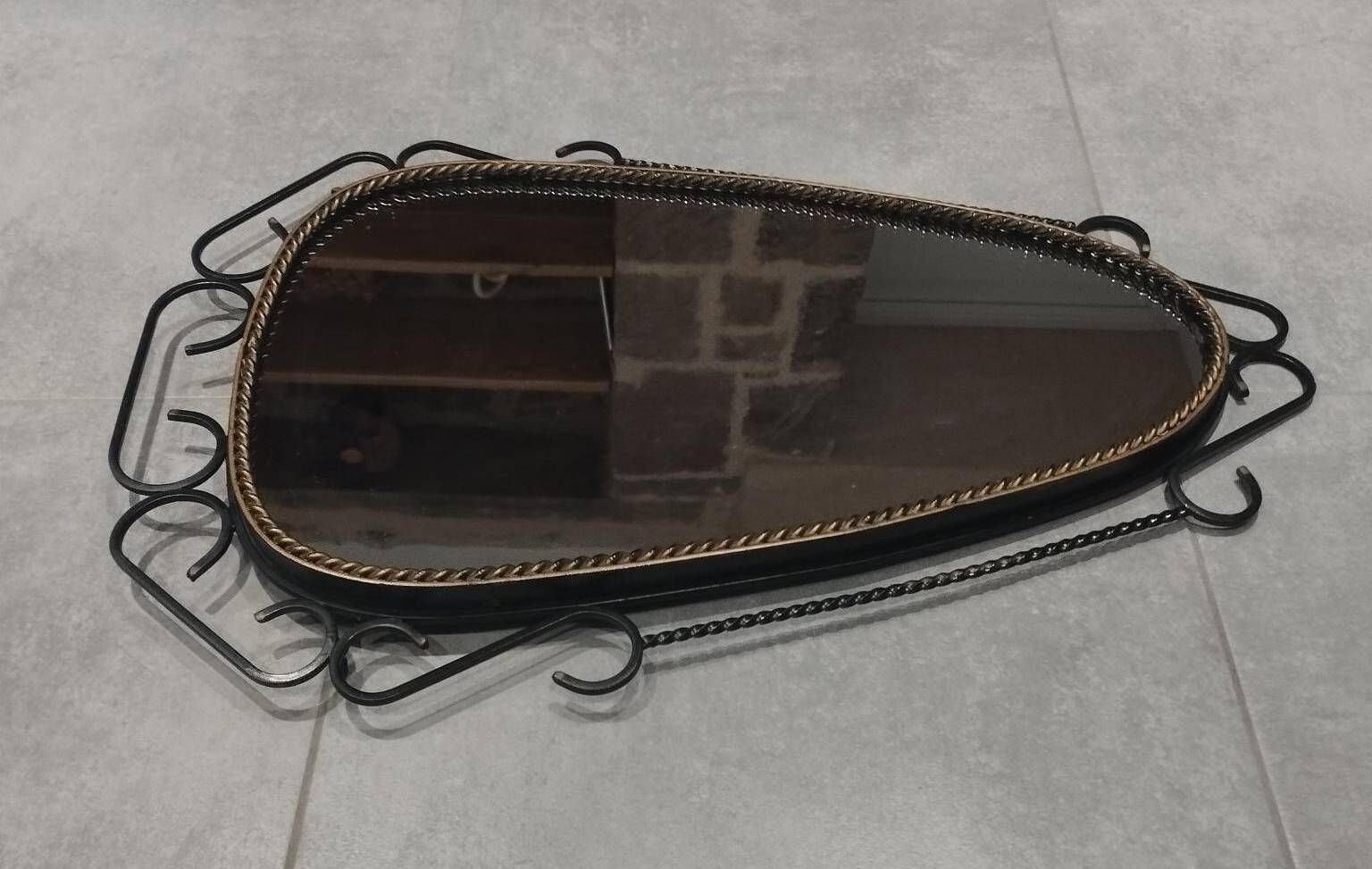 Mid-century modern iron mirror, brutalist, vintage organic, thick sixties.
