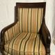 Fauteuil bergère aux dauphins époque Restauration