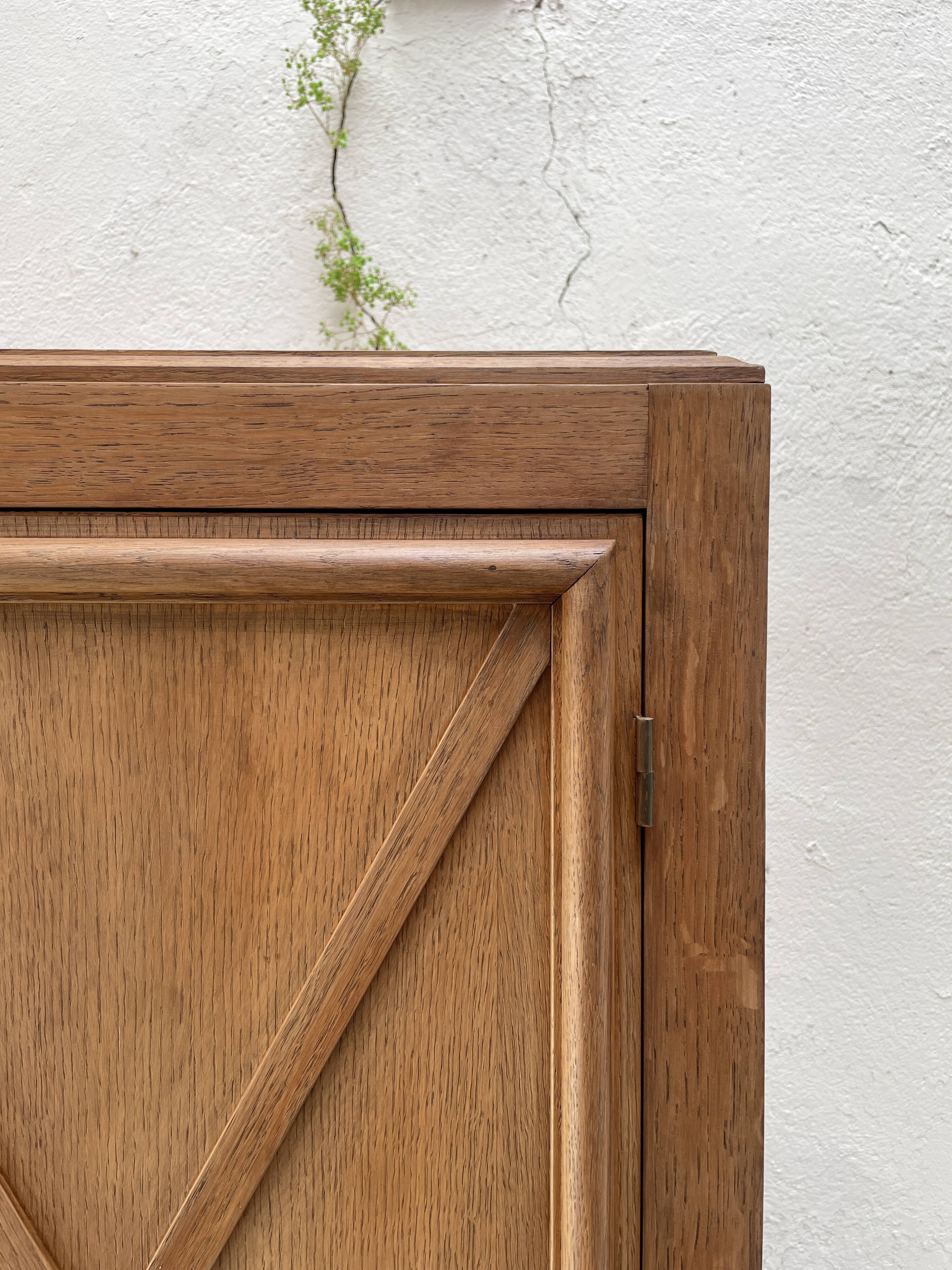 Storage unit in solid oak and veneer, circa 1960.