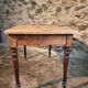 Vintage French pine table with extendable side, circa 1930, suitable for kitchen or office use.
