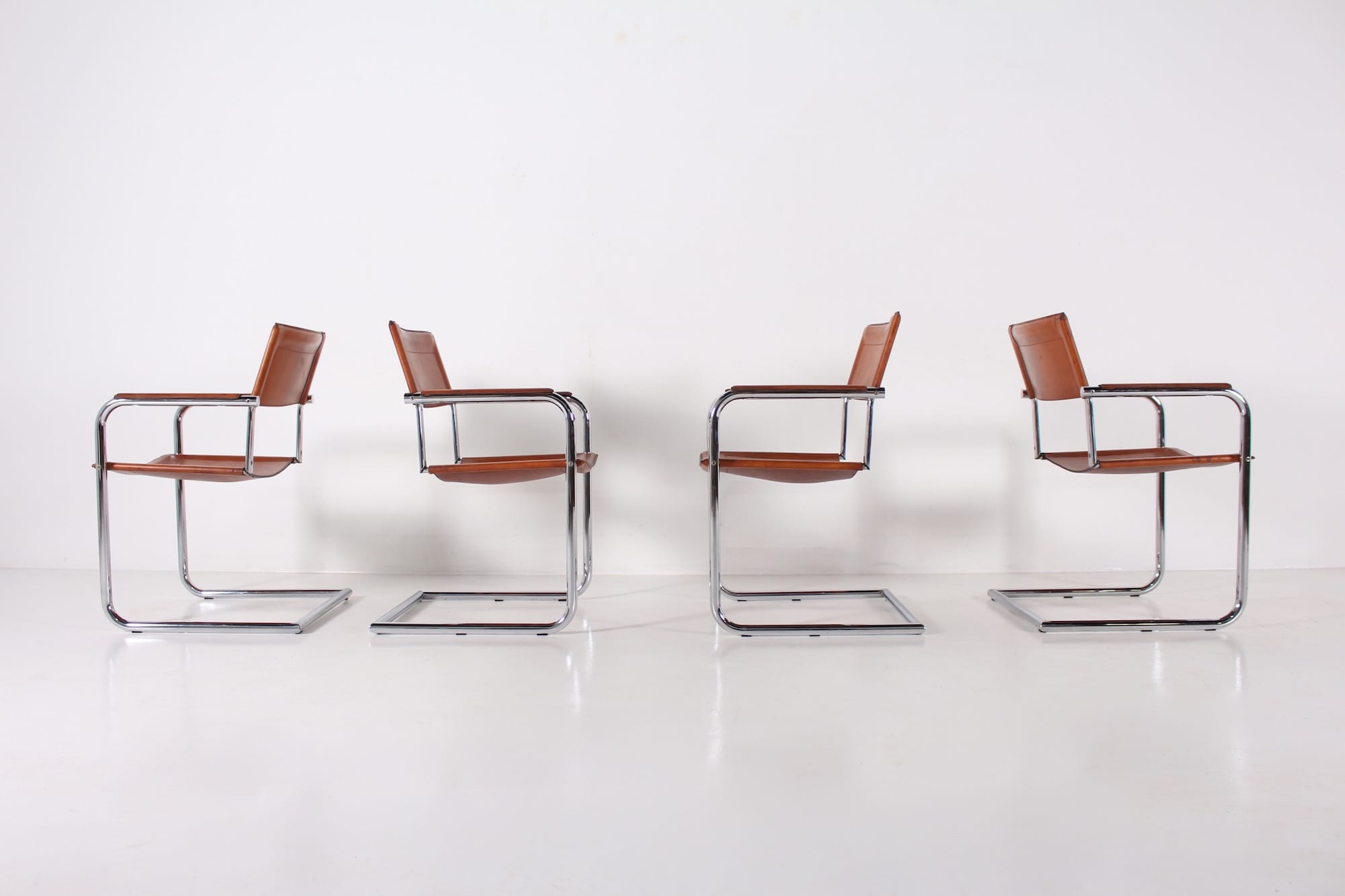 4 Matteo Grassi leather cogna cantilever armchairs