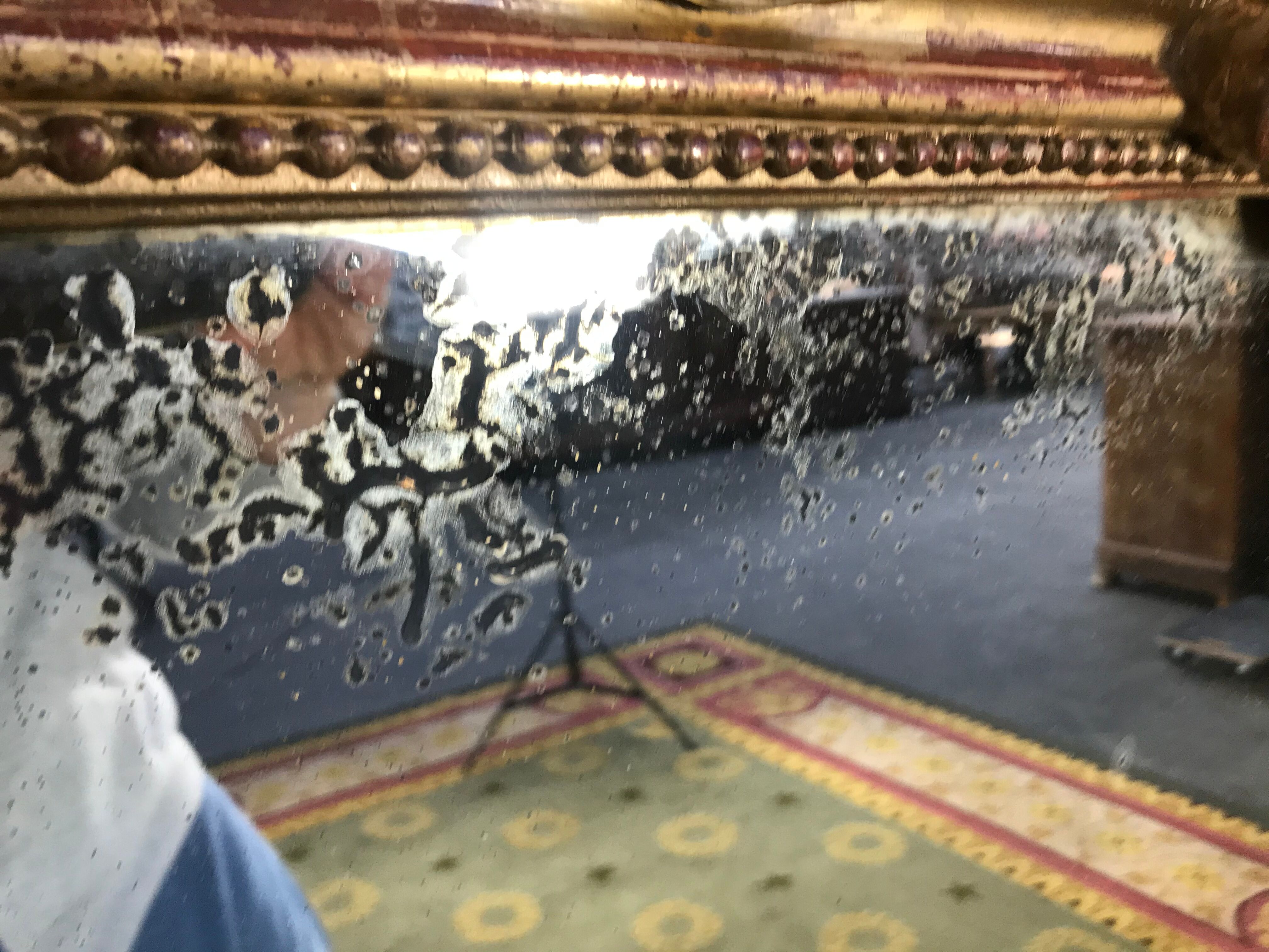 Louis Philippe's era mirror with a gold leaf pediment