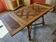 Renovated table with integrated extensions.