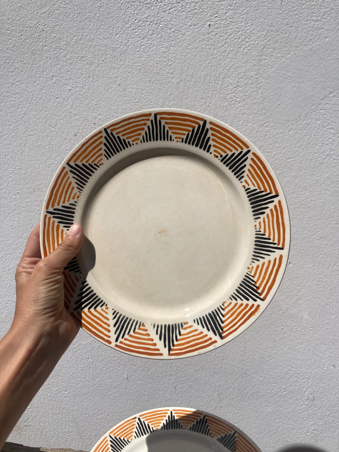 12 flat plates in yellow earthenware Badonviller