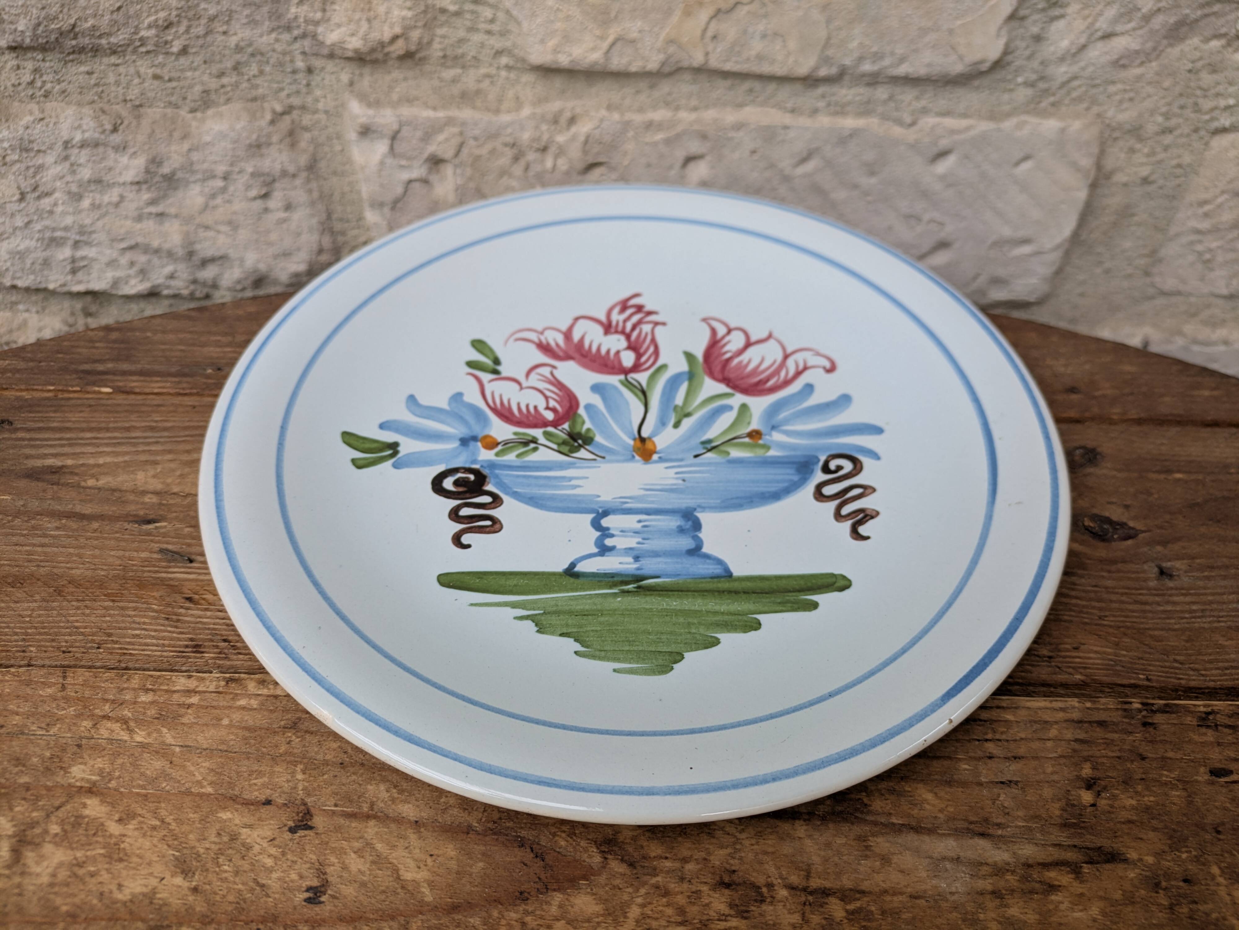 Plate with hand-painted flower bouquet on light blue background 25cm