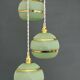 Suspension triple vintage glass globes in frosted green and gold.