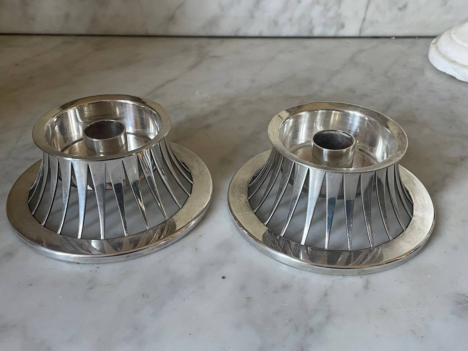 Pair of Keltum Pleet silver metal candlesticks