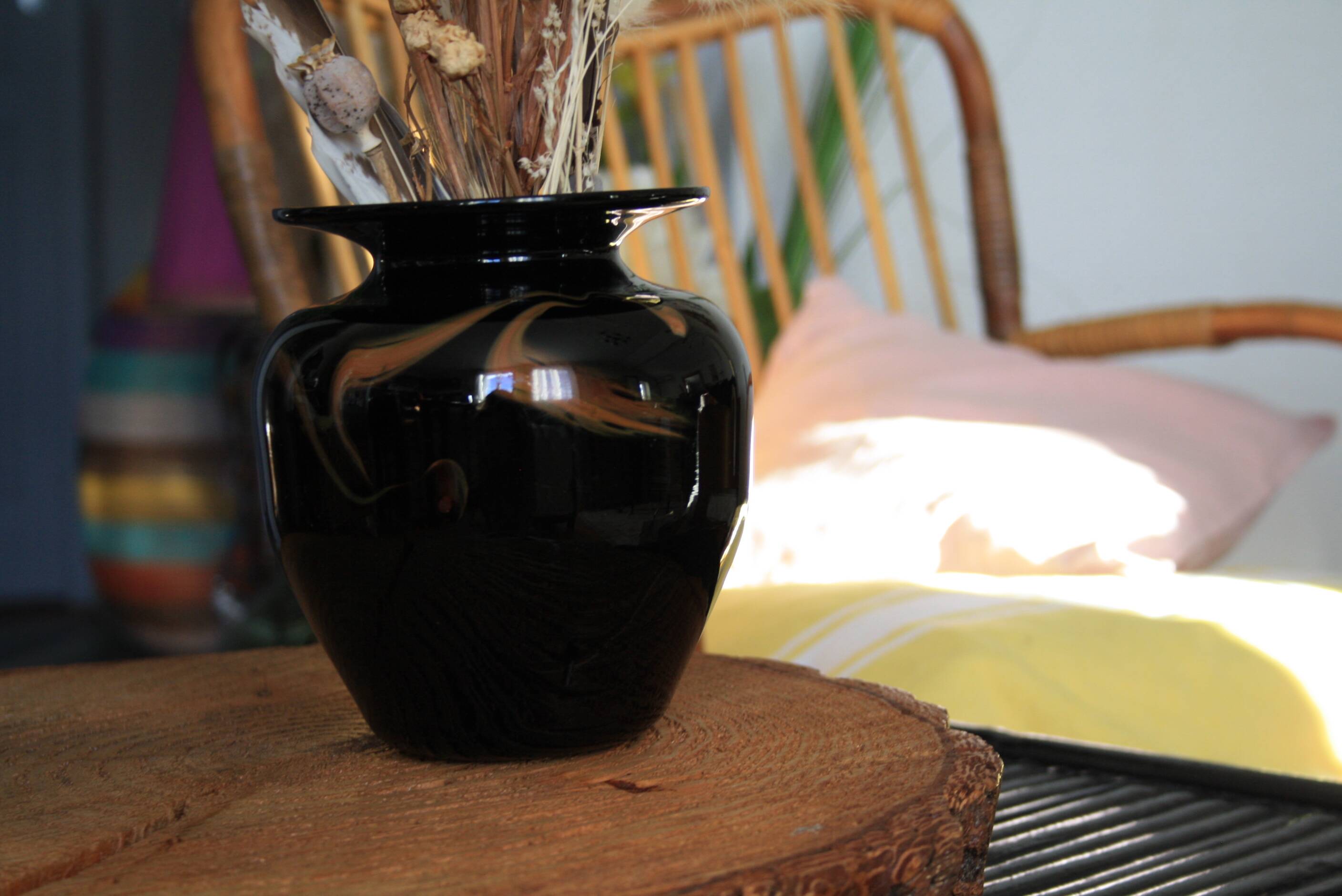 Black vase stamped MV