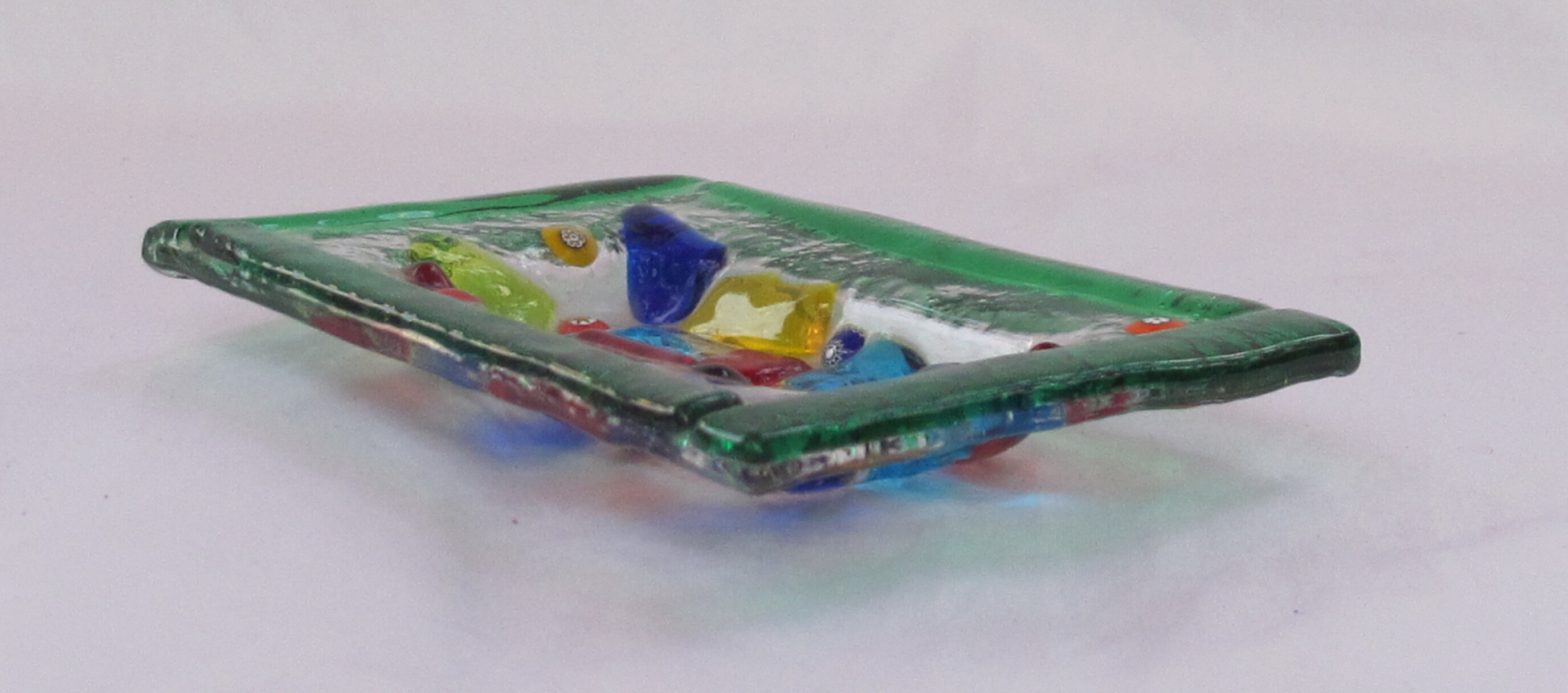 Empty millefiori-style glass pocket