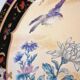 Vintage Japanese decorative plate with chrysanthemum and bird patterns.