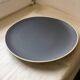 Asymmetrical grey stoneware plate 26 cm