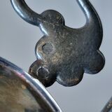 Old empty cut pocket in silver metal art nouveau in the shape of a sheet