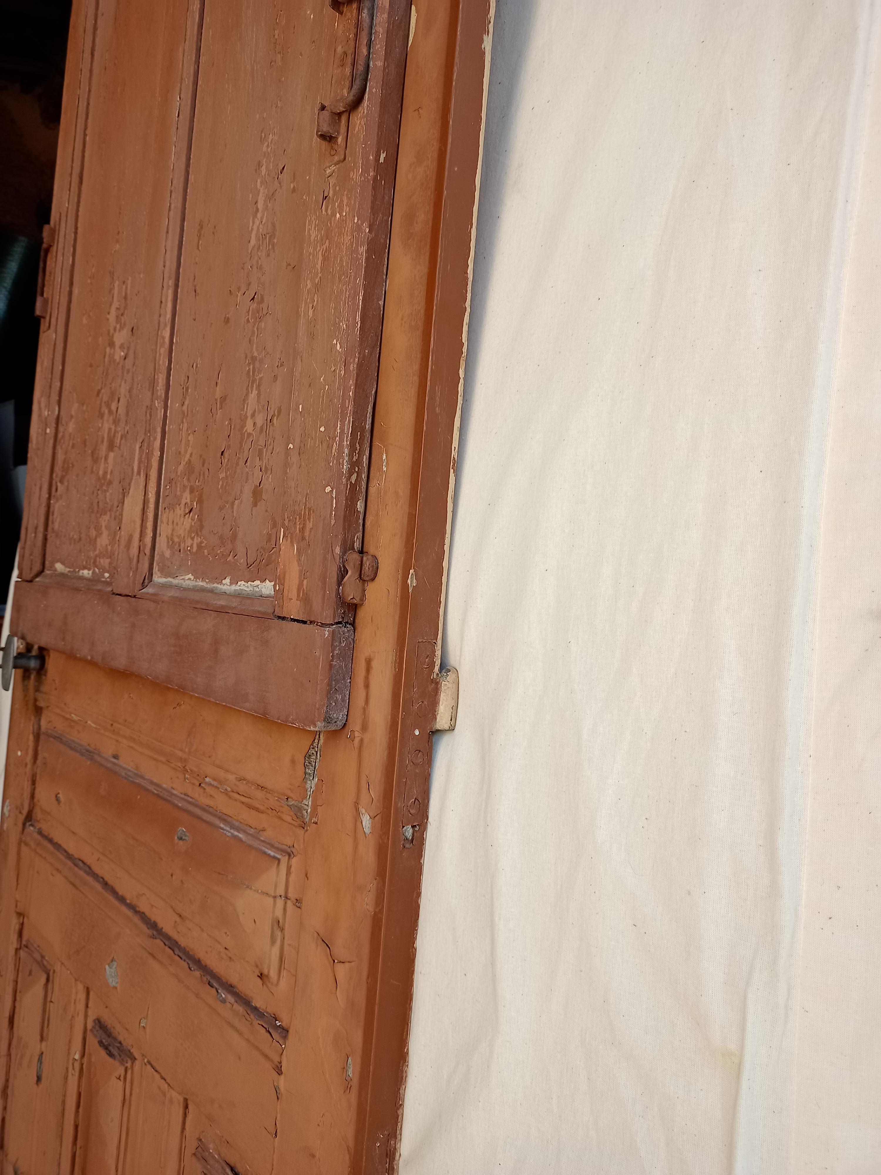 Old glazed door with its shutter