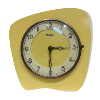 Electric clock in yellow formica