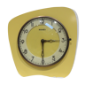 Electric clock in yellow formica