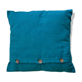 Scandinavian green cushion with wooden buttons