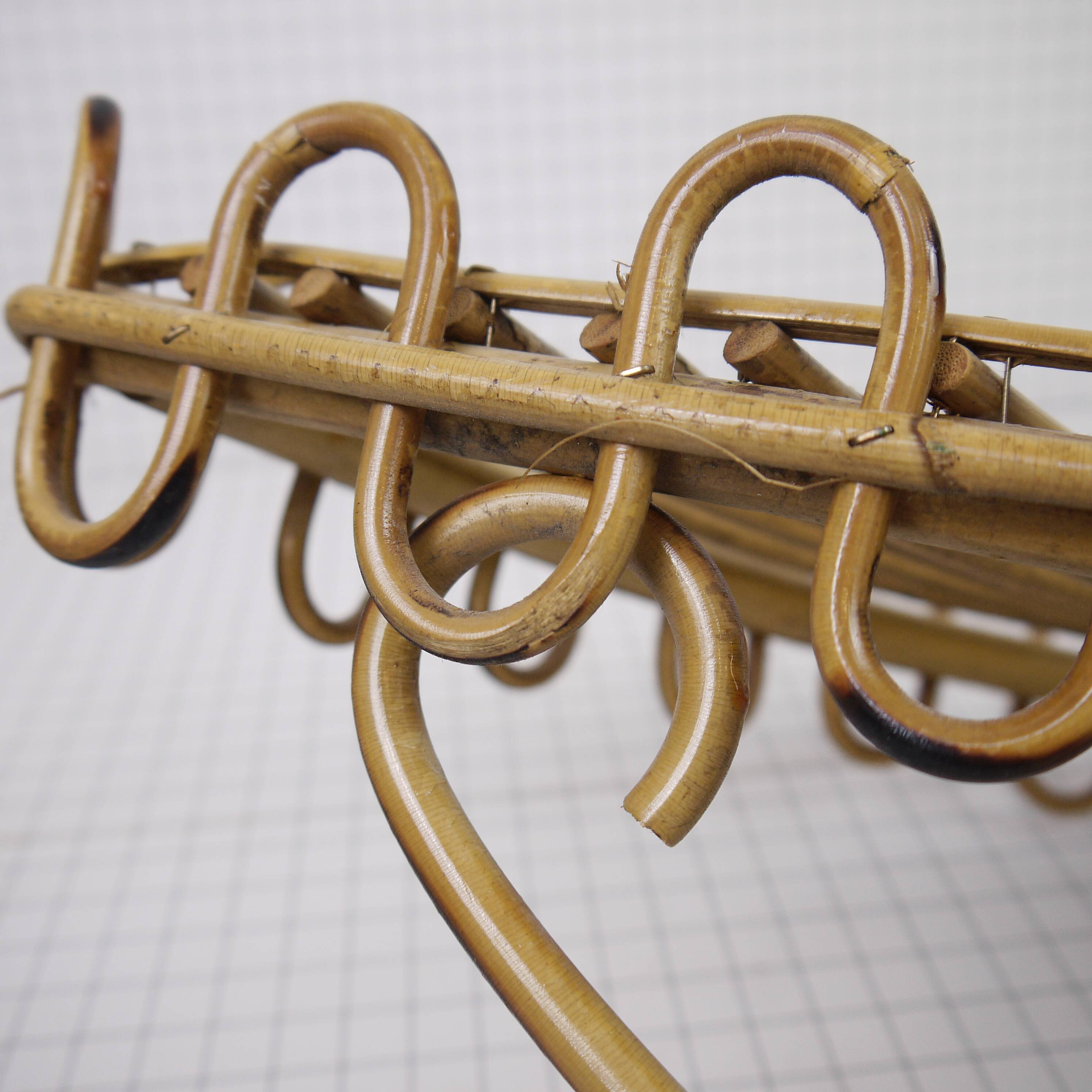 Half-moon rattan shelf and coat holder
