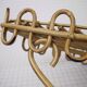 Half-moon rattan shelf and coat holder